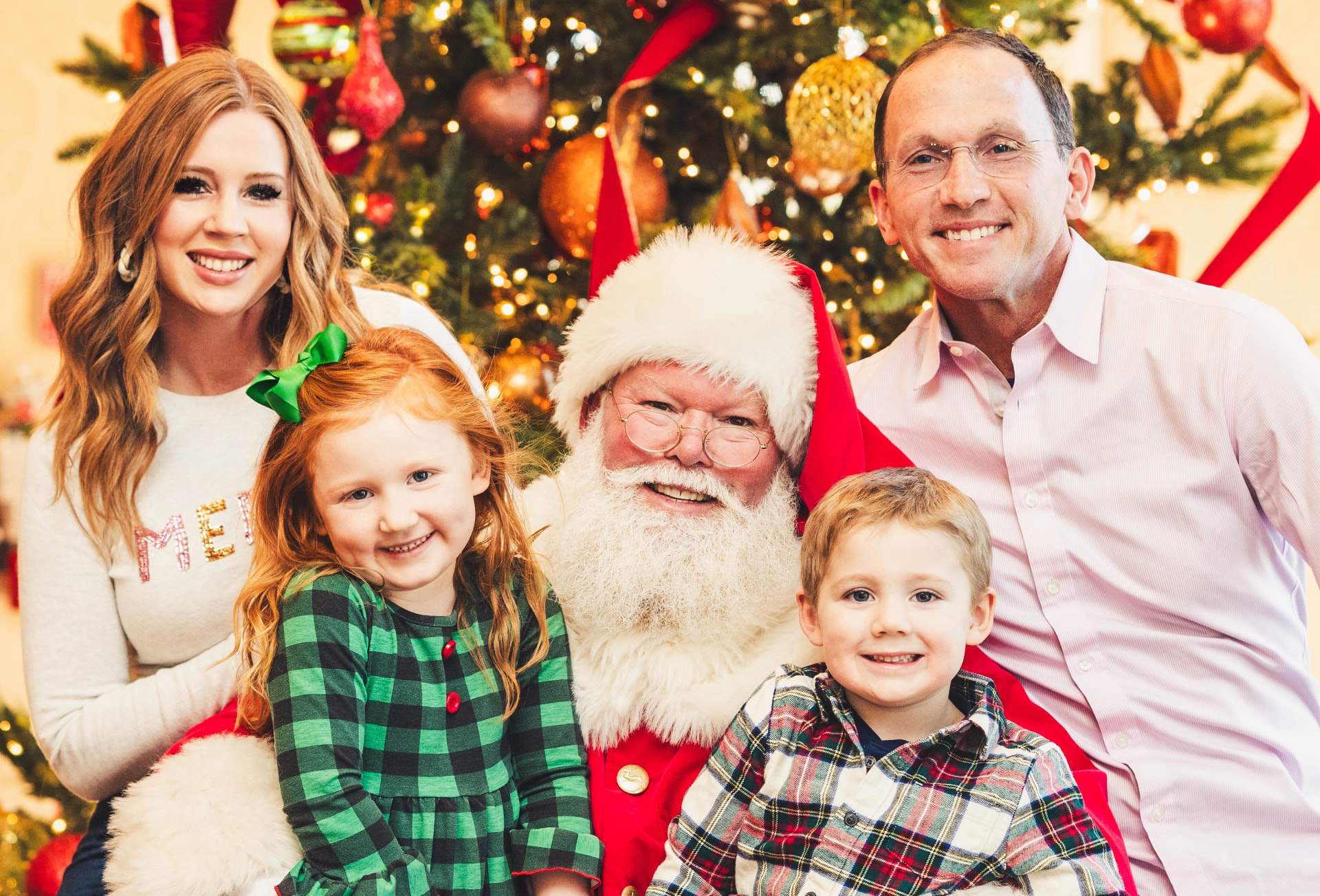Kevin's family with Santa at Christmas
