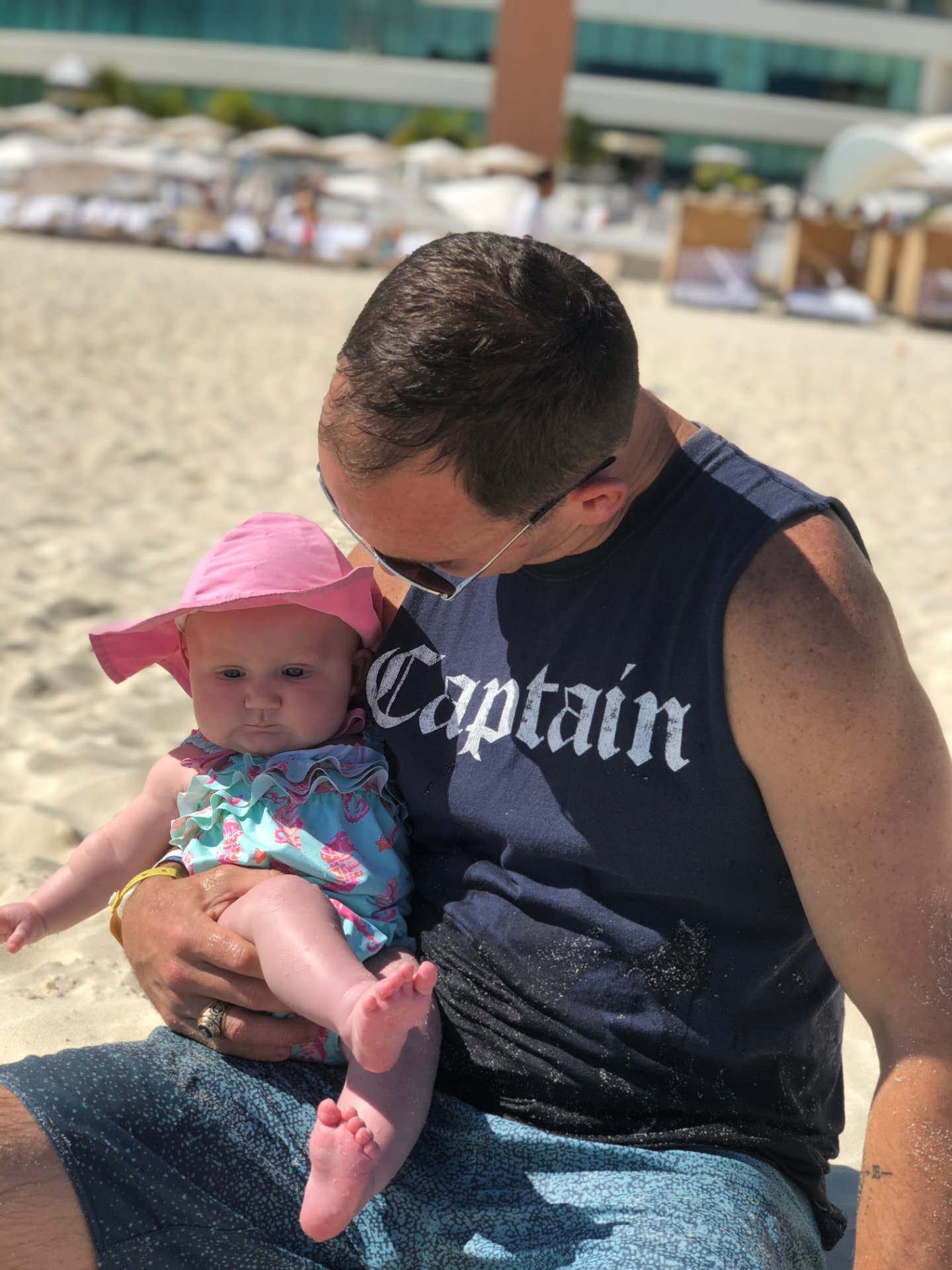 Kevin with his daughter on the beach