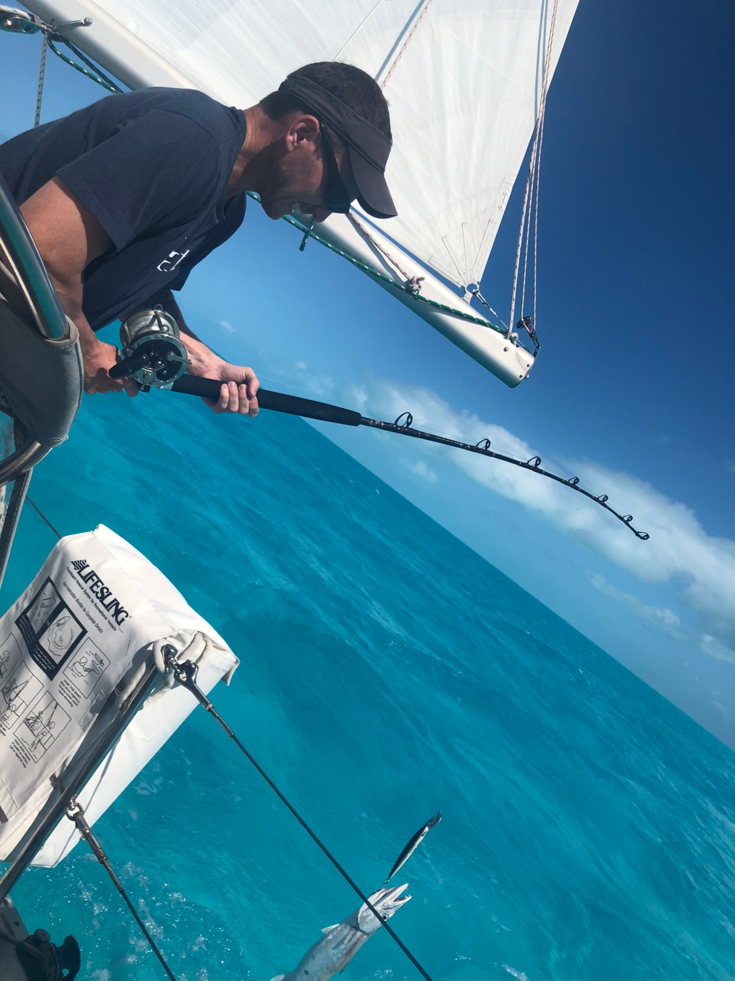 Kevin deep sea fishing from a sailboat